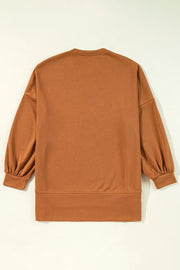Caramel graphic sweatshirt with balloon sleeves and slit hem detail