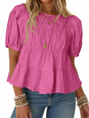 Rose pink maternity blouse with puff sleeves, ruffled tiers, and smocked bodice.