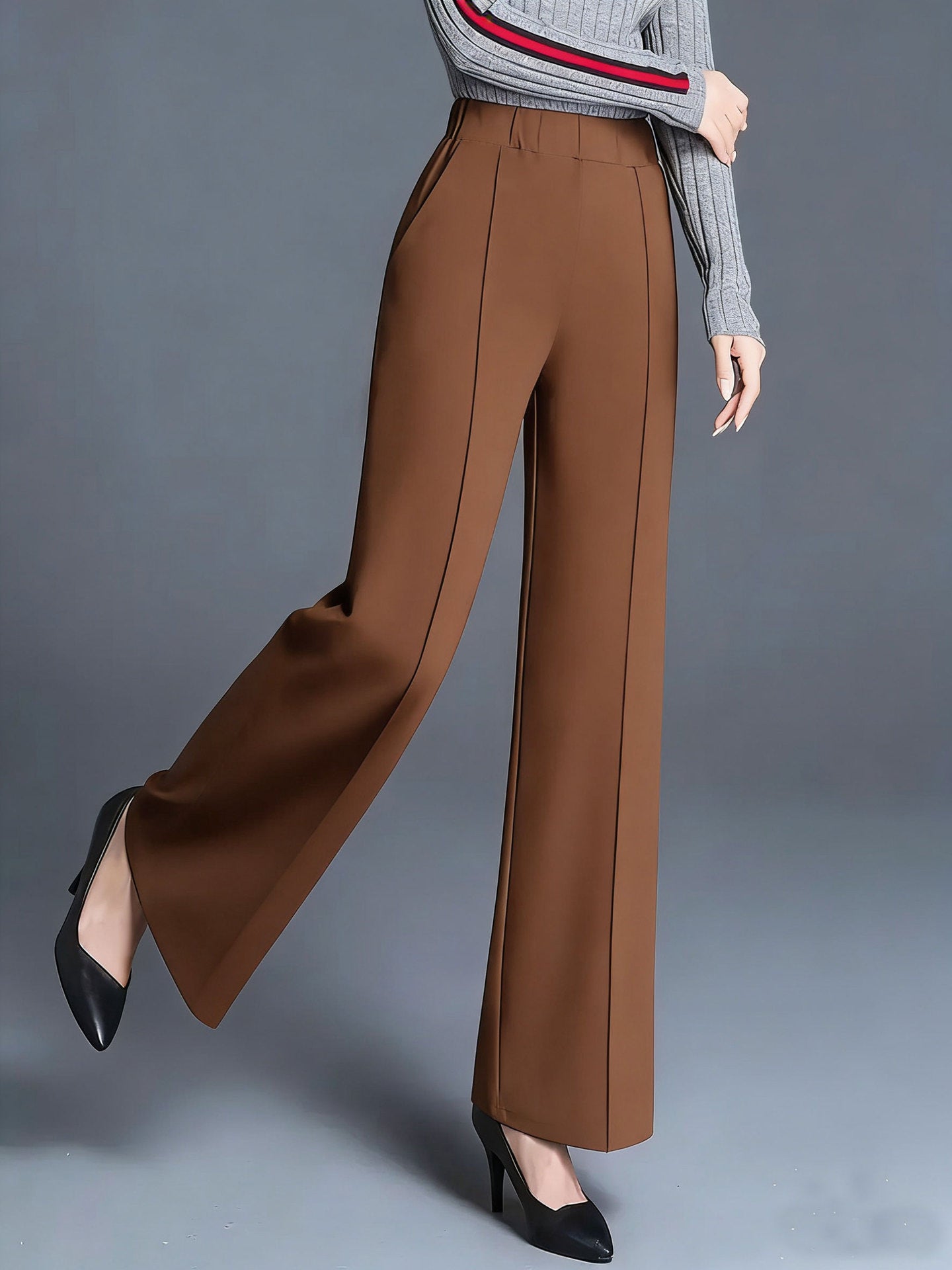 Brown high-waisted wide leg cotton trousers with pockets and front seam detail.