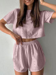Dusty pink perforated crop top and shorts set with a breathable, casual chic style.