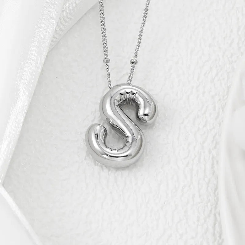 Silver letter S pendant necklace with beaded chain