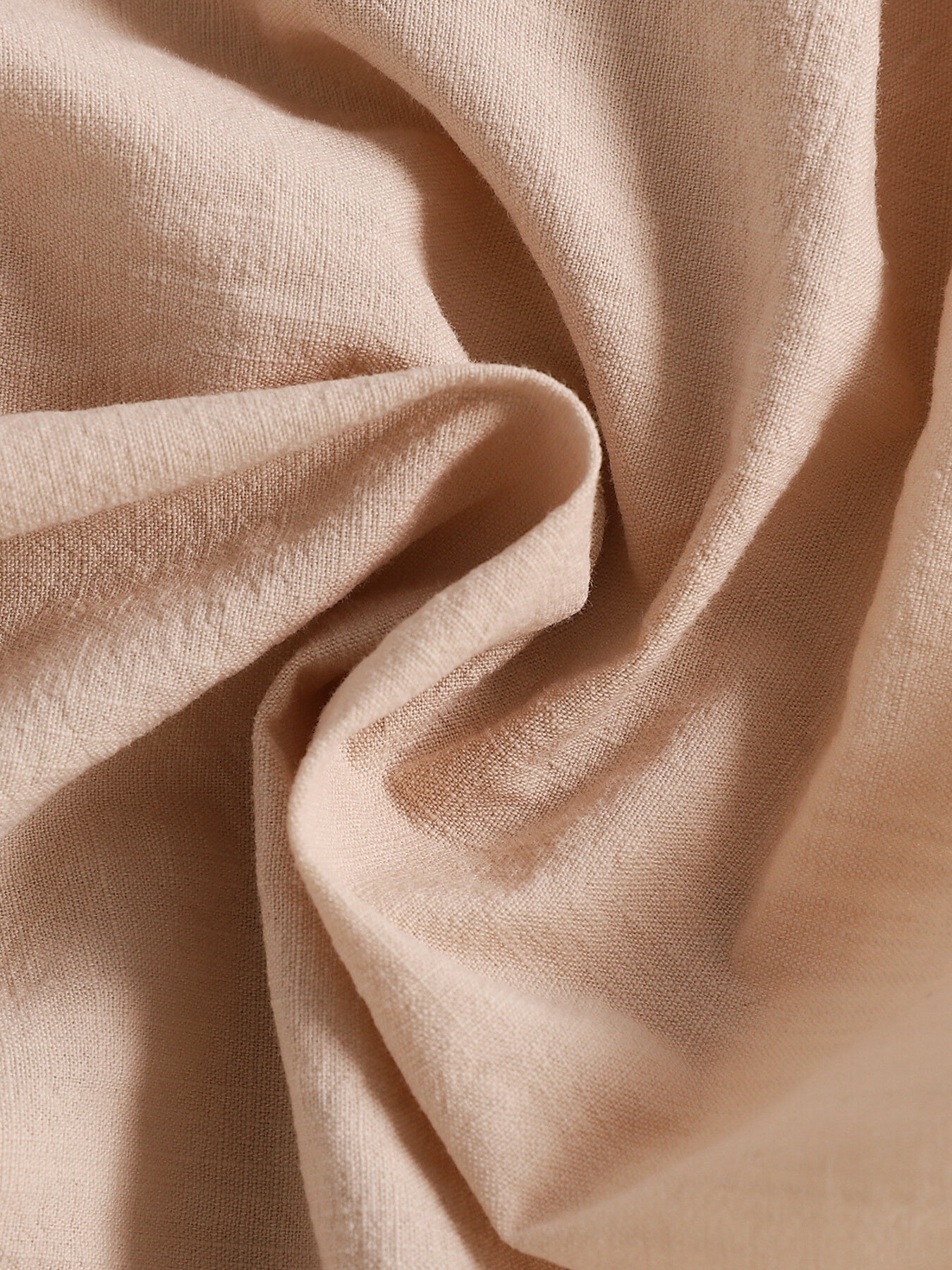 Apricot baby set fabric detail, textured weave
