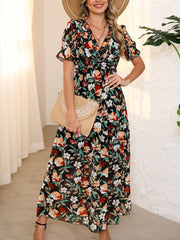 Black floral print maxi dress with V-neck, ruffled short sleeves, and cinched waist.
