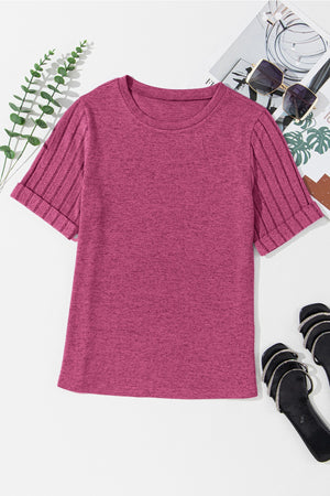 Hot pink t-shirt with ribbed short sleeves and rolled cuffs.