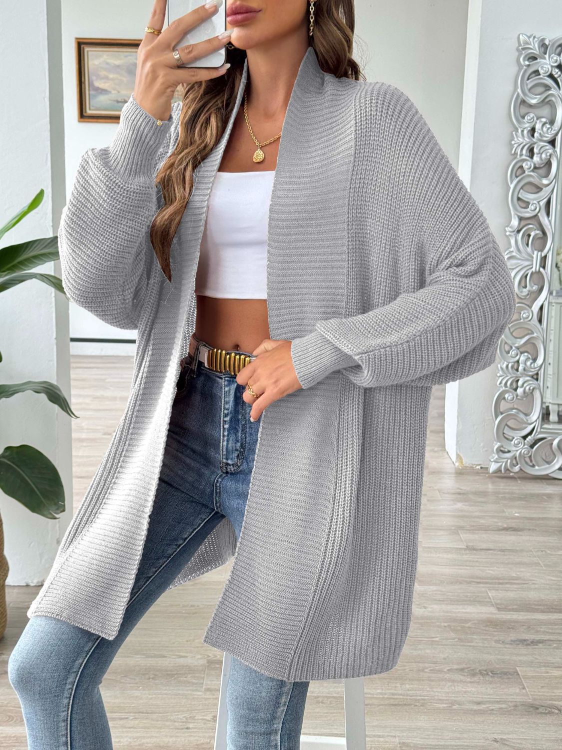 Gray ribbed knit cocoon cardigan with open front and long sleeves.