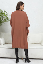 Oversized pocketed knit cardigan in caramel with a relaxed fit and long sleeves.