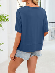 Relaxed fit blue V-neck t-shirt with short sleeves and a layered hem detail.