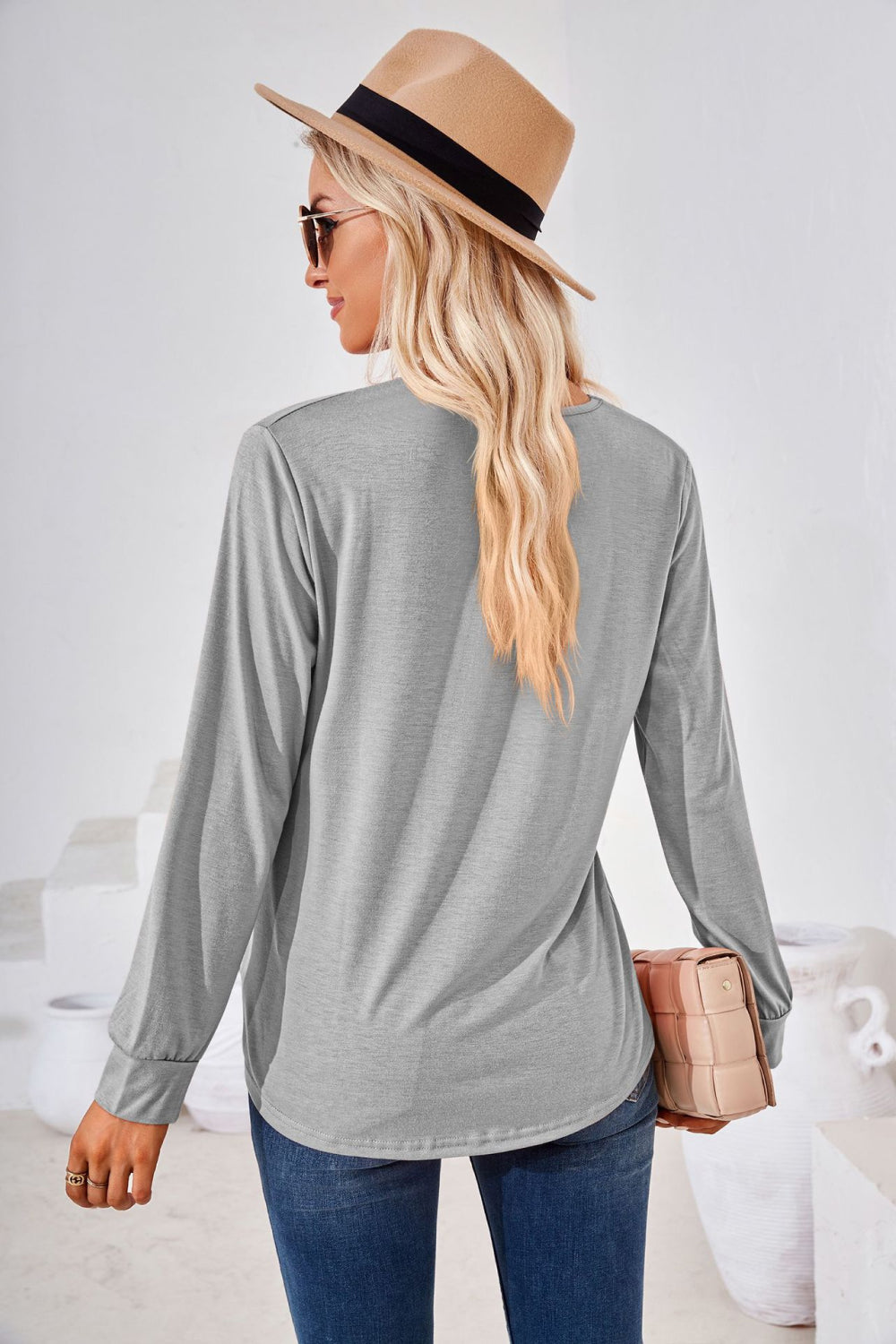 Light gray long sleeve jersey top with gathered square neckline.