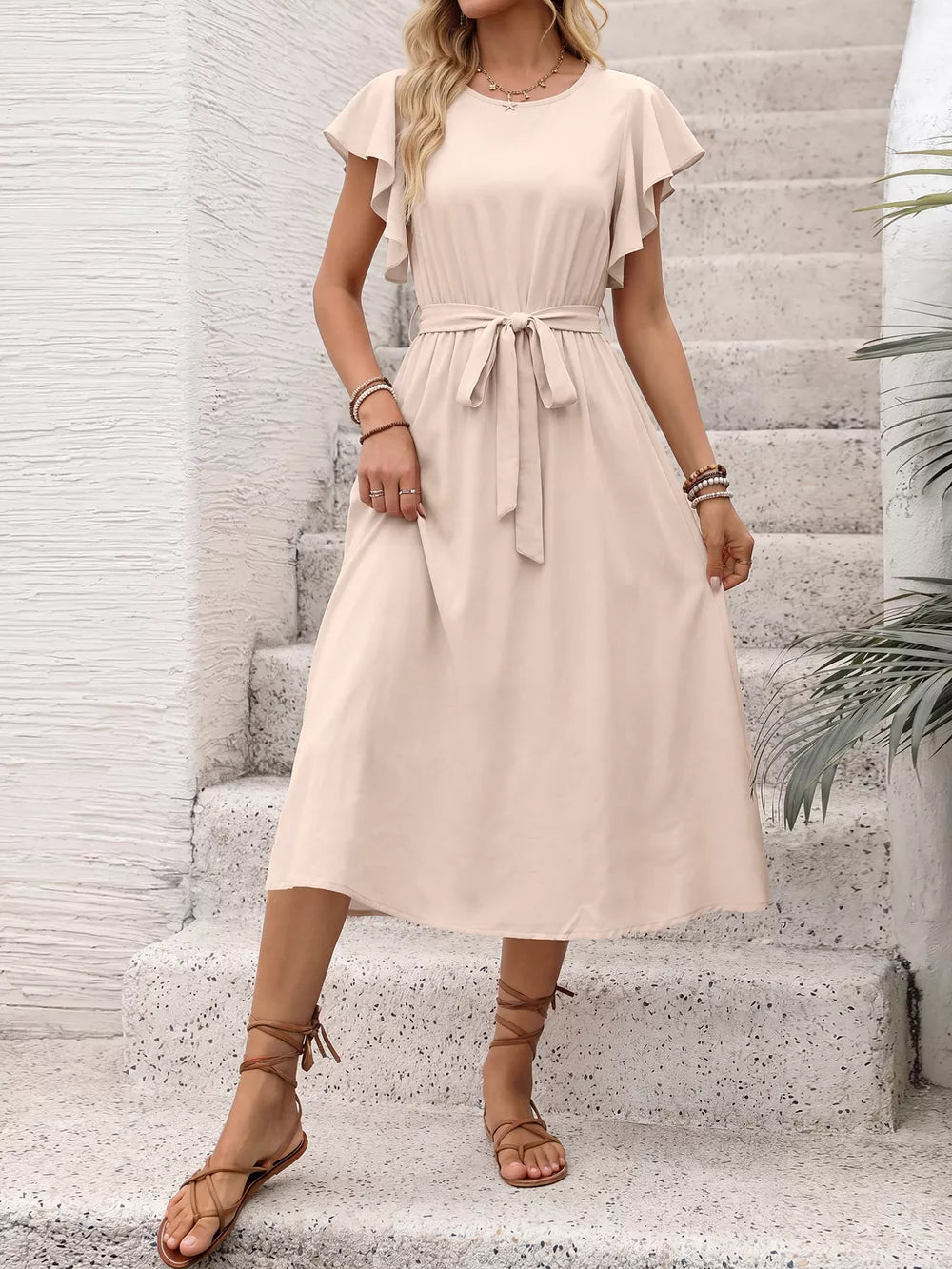 Beige midi dress with ruffled sleeves, tie waist, and button-down front.