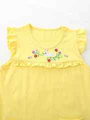 Yellow cotton toddler undershirt with ruffled sleeves and hem, featuring a bunny and floral embroidery.