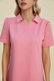 Pink textured V-neck short sleeve mini dress with geometric pattern
