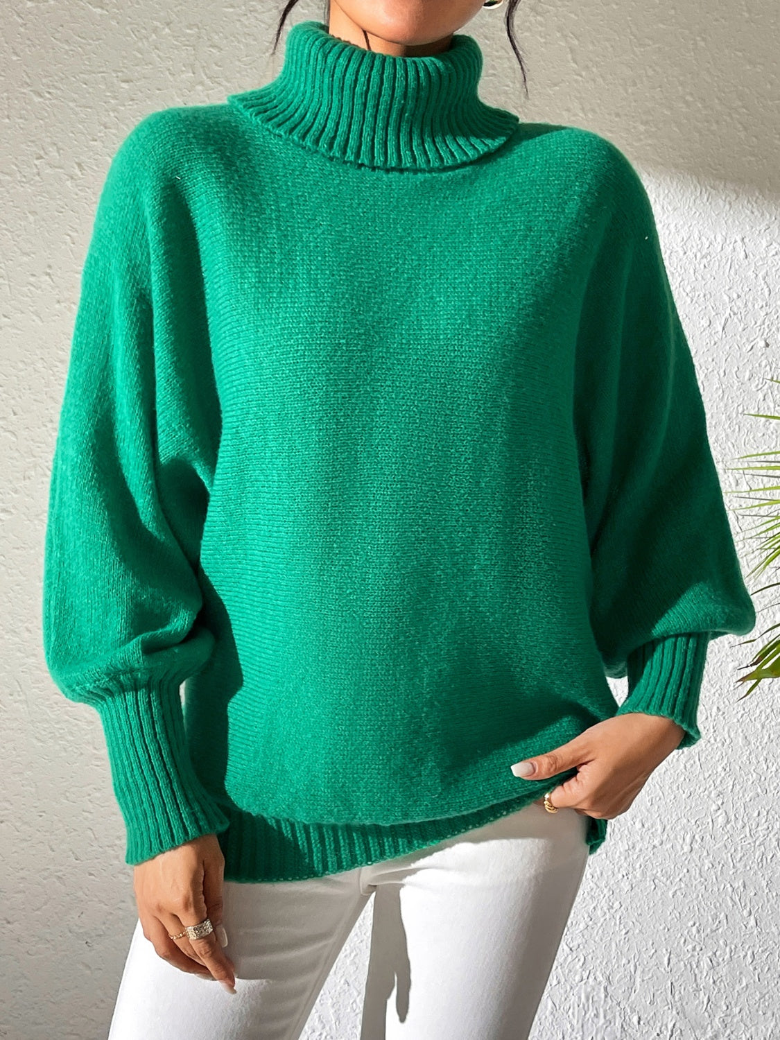 Dark Green balloon sleeve turtleneck sweater with ribbed cuffs and collar.