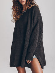 Oversized open-knit sweater dress in black with crew neck and long sleeves.