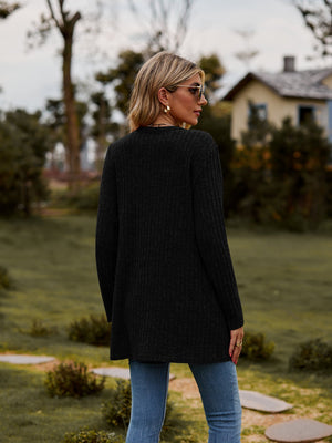 Black longline ribbed knit button-down cardigan with long sleeves and a relaxed fit.