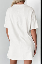 White cotton t-shirt dress with short sleeves and a relaxed silhouette.