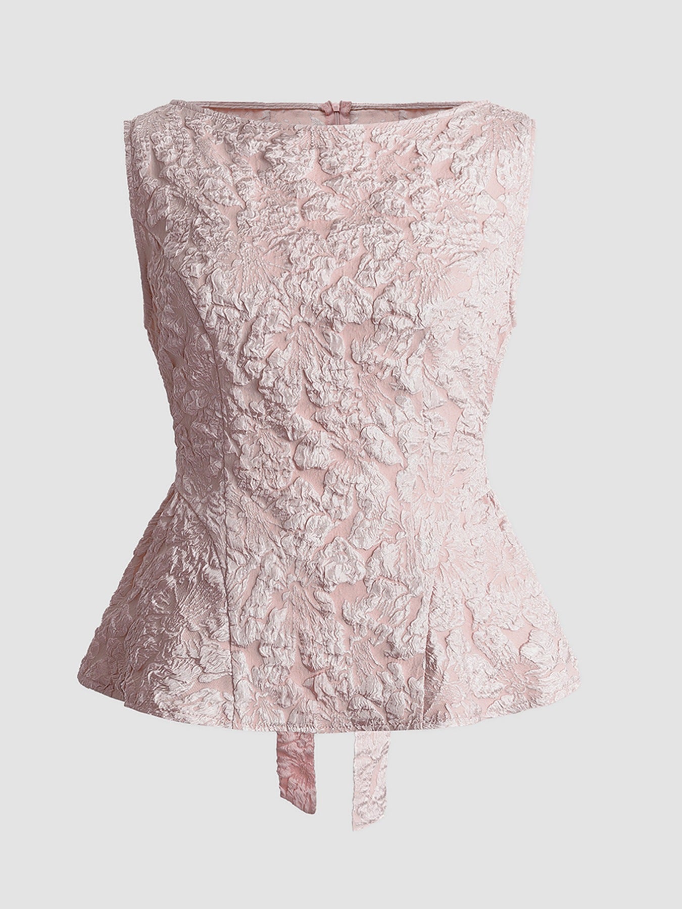 Dusty pink textured floral peplum tank top with boat neckline and tie detail.