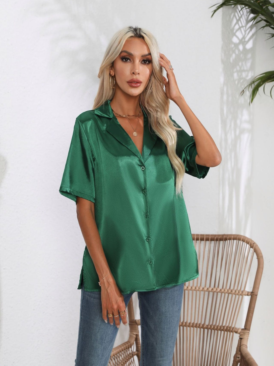 Emerald green satin collared short sleeve buttoned shirt with a relaxed fit.