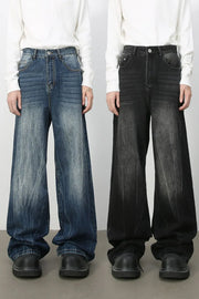Oversized palazzo jeans in dark wash and medium wash denim with a distressed effect.
