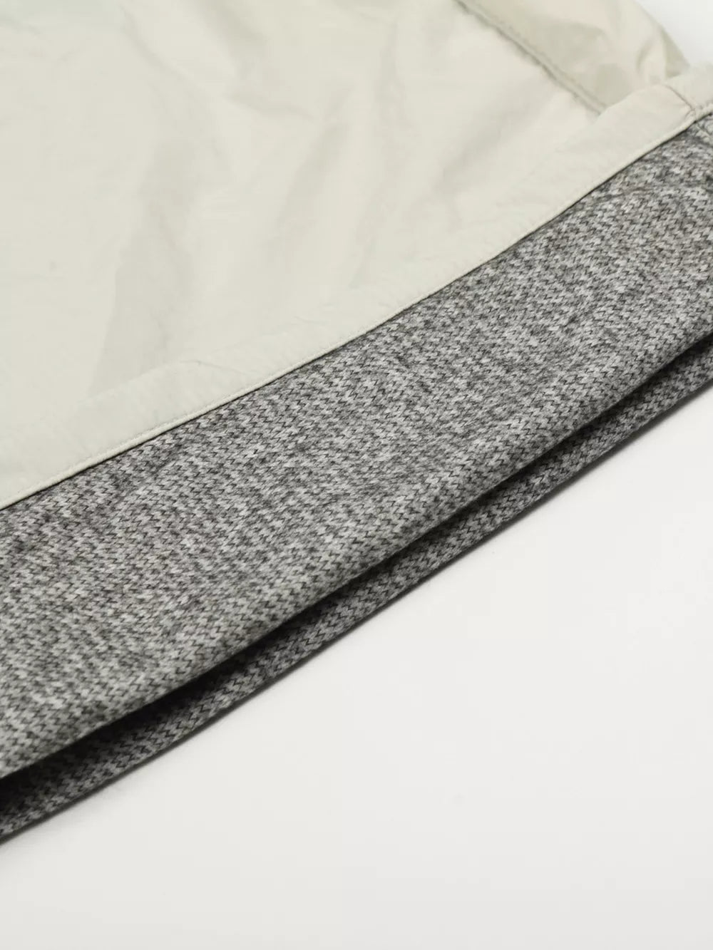 Men's wide-leg sweatpants in gray with a crinkled texture and contrasting light gray panel.