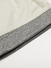 Men's wide-leg sweatpants in gray with a crinkled texture and contrasting light gray panel.