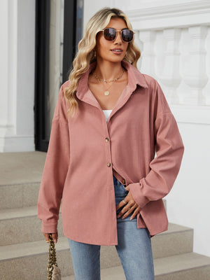 Oversized corduroy shirt jacket in Dusty Pink with button front and collar.
