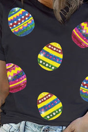 Black crewneck tee with colorful sequin Easter egg appliques.