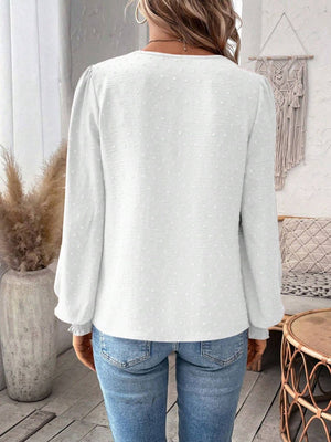 White textured blouse with puff sleeves and embroidered yoke detail