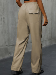 Khaki gathered-leg utility trousers with cuffed ankles and a back pocket detail.