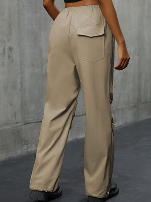 Khaki gathered-leg utility trousers with cuffed ankles and a back pocket detail.