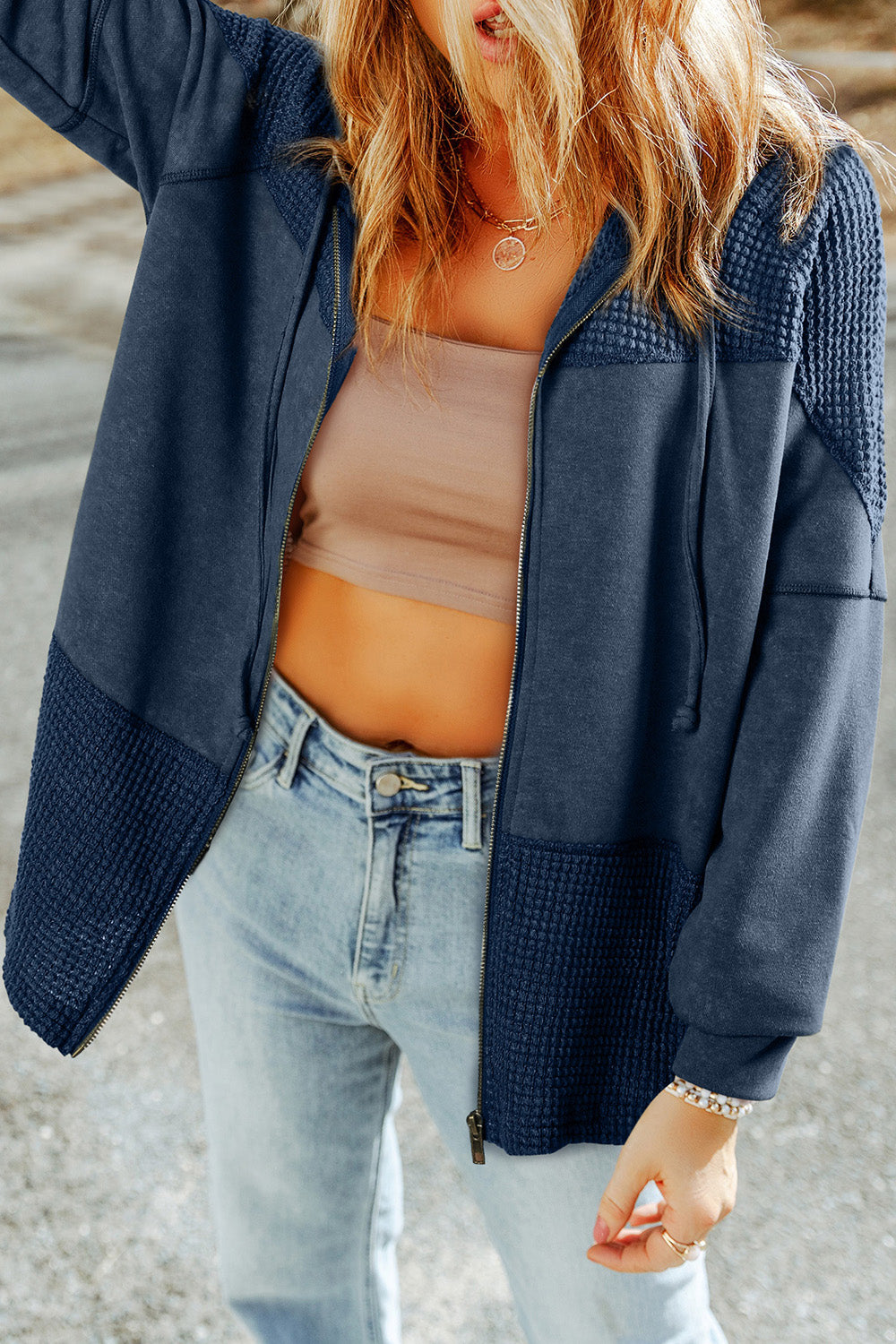 Peacock Blue colorblock knit zip-up hoodie with waffle texture details on shoulders and cuffs.