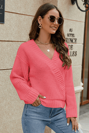 Wrap knit v-neck pullover in hot pink with a textured knit and relaxed fit.