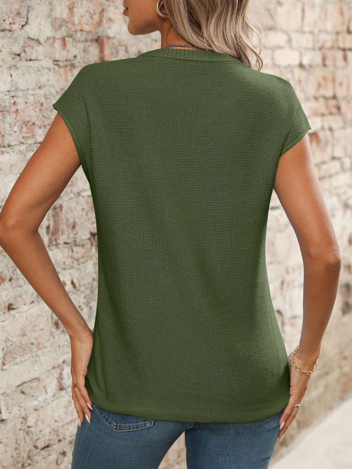 Moss green seamed knit sleeveless v-neck top with a textured knit.