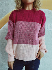 Colorblock textured knit pullover sweater in pink and maroon with a mock neck.