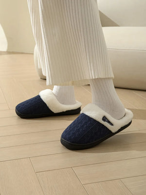 Dark Navy cable knit shearling house slippers with white trim.