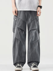 Loose fit grey cargo pants with drawstring and multiple pockets.