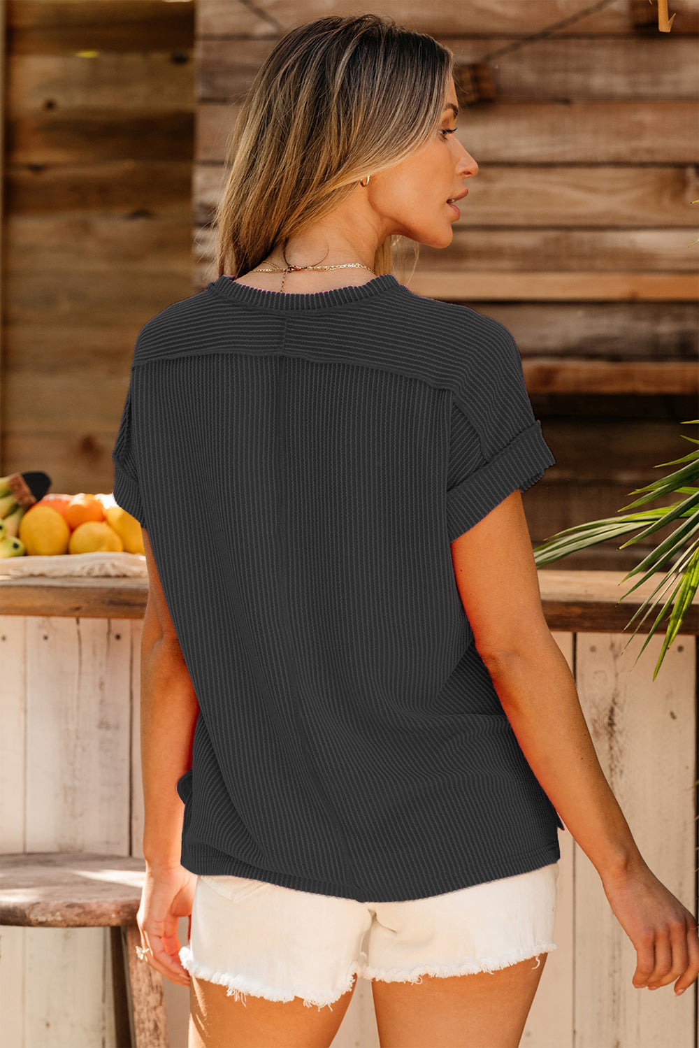 Textured ribbed tee in dark gray with cuffed short sleeves and a relaxed fit.
