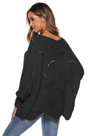 Black openwork cocoon sleeve knit sweater with boat neck and relaxed fit.