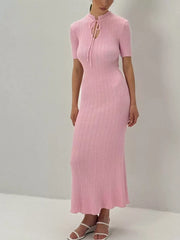 Blush pink knitted mermaid dress with short sleeves and tied neckline