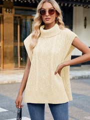Cream cable knit turtleneck vest with side slits, acrylic material.