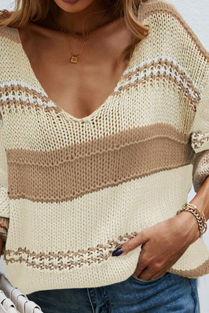 Deep plunge knit pullover sweater with colorblock stripes in cream and caramel.