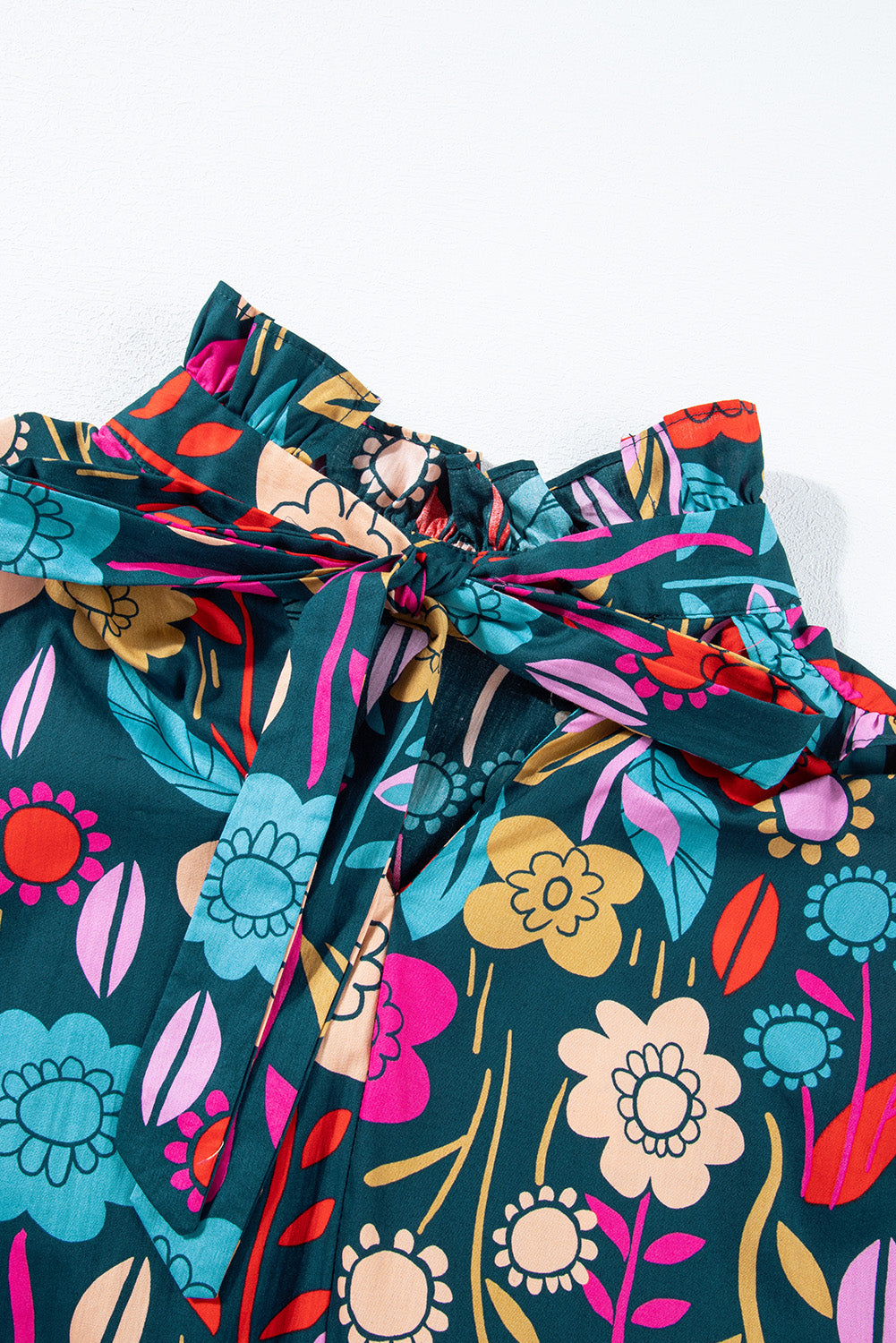 Botanical ruffle-sleeve tie-neck blouse in floral print with a self-tie bow detail.