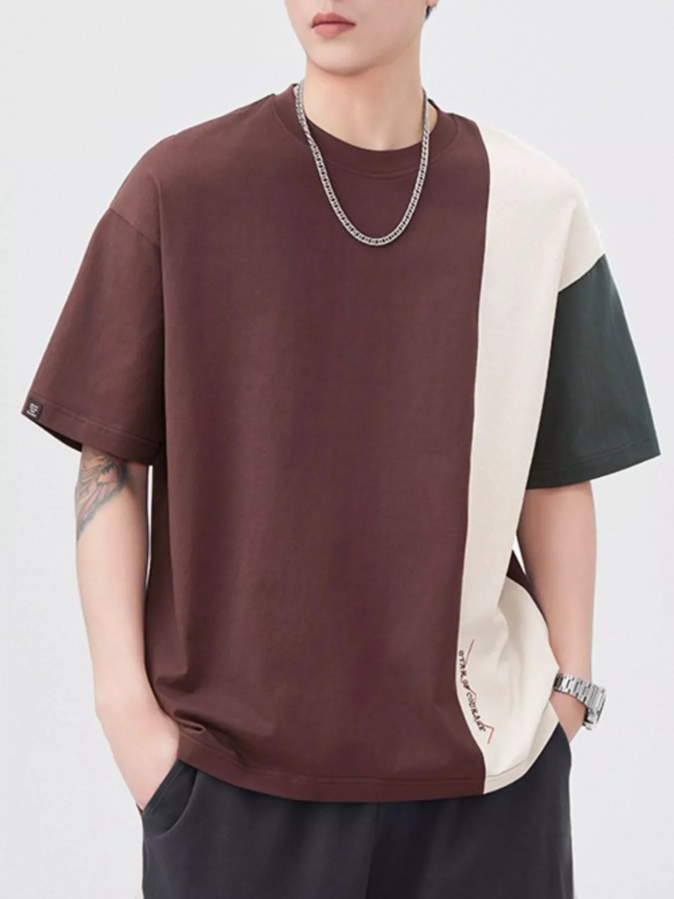 Oversized cotton t-shirt with color block design in coffee brown, cream, and dark gray.