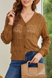 Caramel openwork knit cardigan with balloon sleeves and button front.