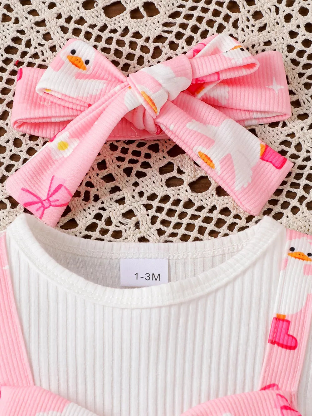Children's Bow Duck Print Romper With Headband in Pink, side view