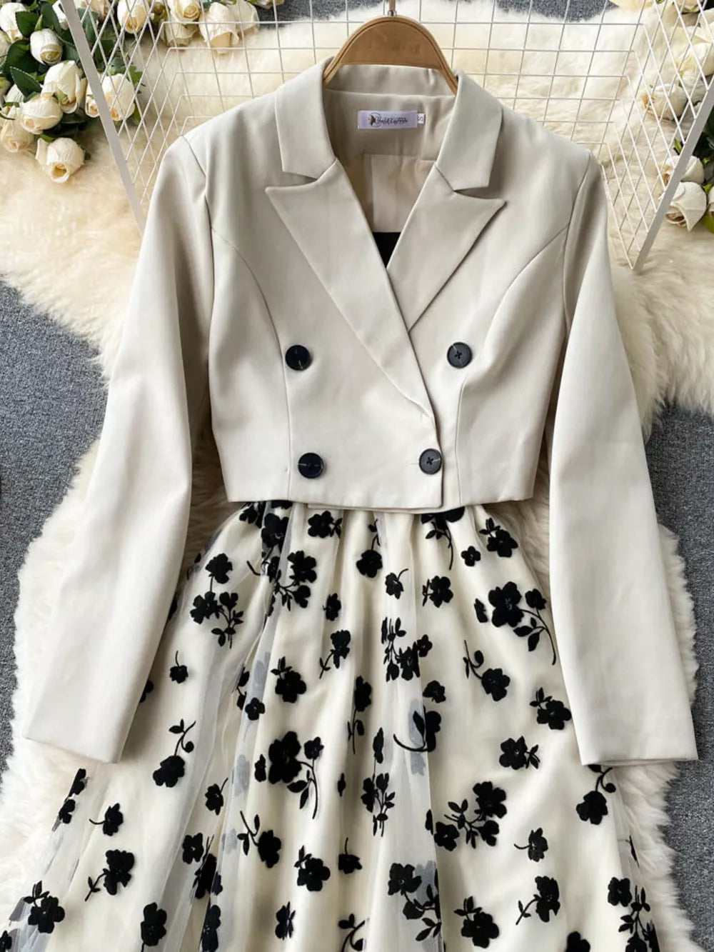 Maternity midi dress with black floral overlay and matching cream double-breasted blazer.