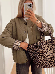 Moss green quilted button-down jacket with leopard print cuffs and matching tote bag.