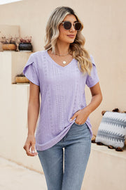 Perforated sleeve detail knit top in lavender with V-neck and short sleeves.