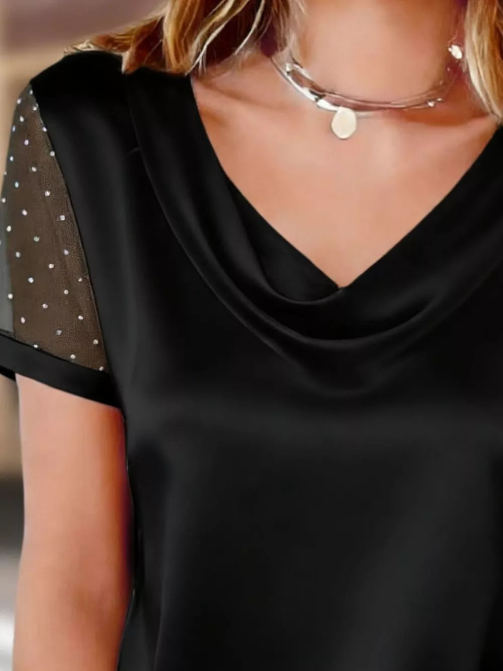 Black cowl neck blouse with sheer, rhinestone-embellished sleeves
