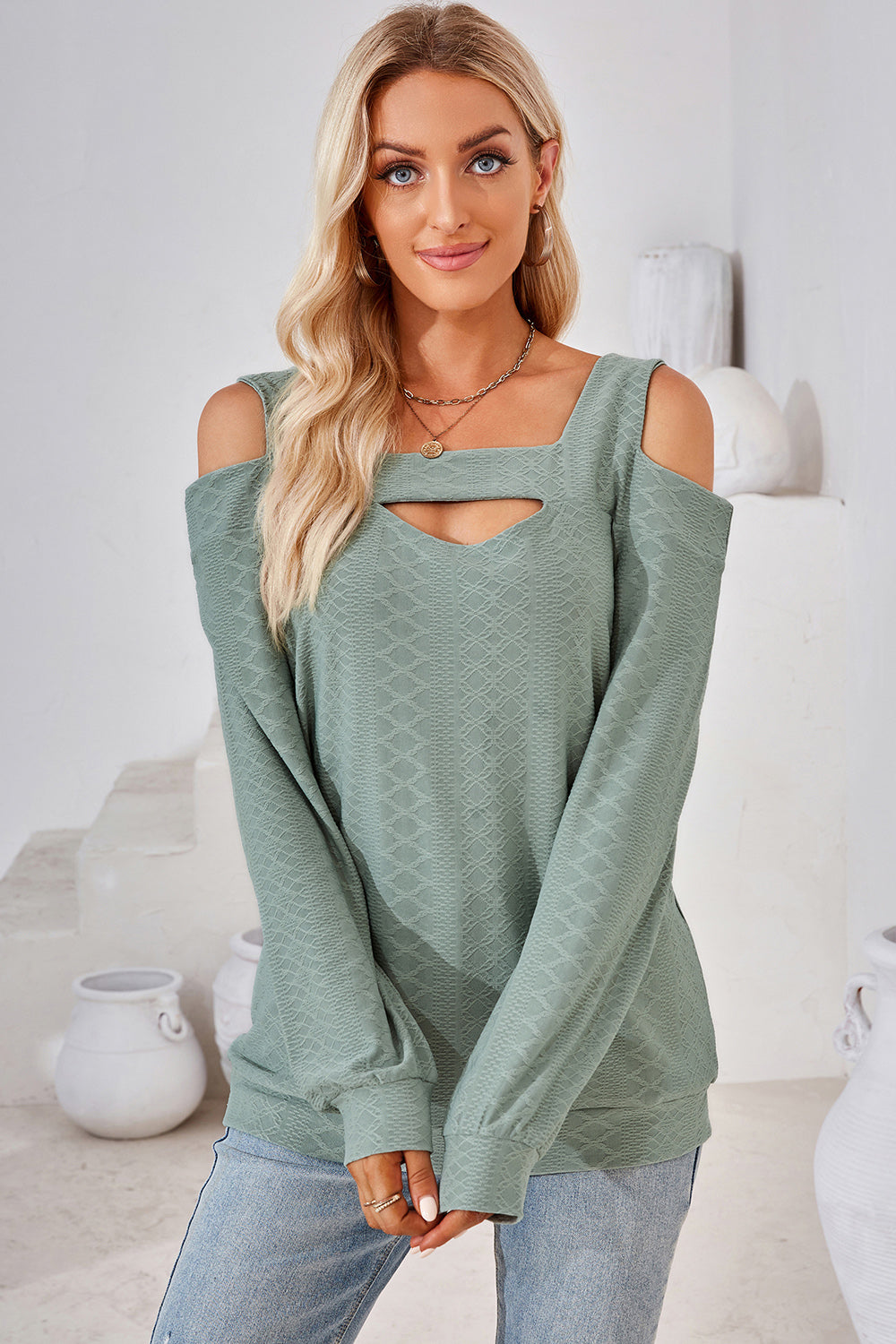 Light Green Geometric Cutout Shoulder Top with square neckline and long sleeves.