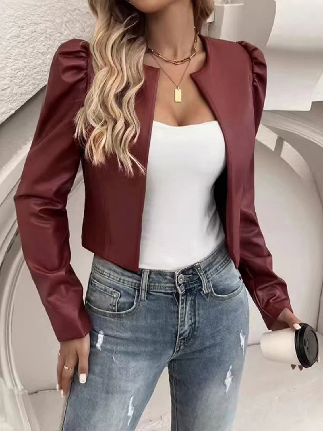 Burgundy vegan leather bolero jacket with puffed shoulders and a cropped cut.